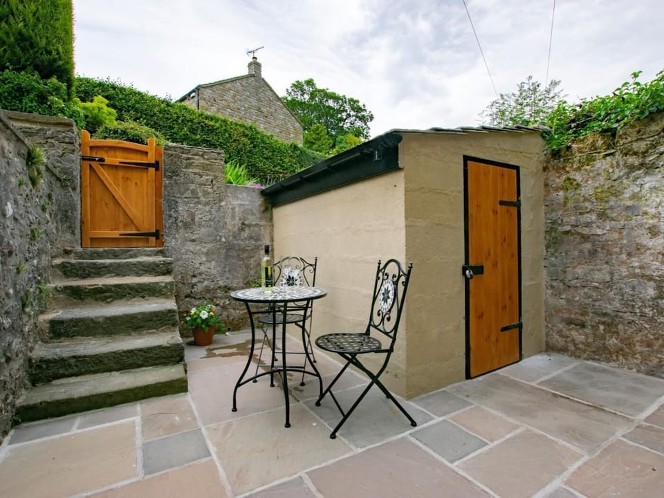 Fully enclosed patio with large secure bike shed