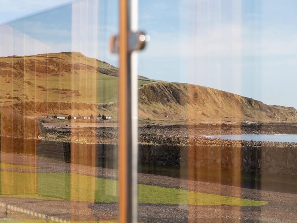 Panoramic glass enclosed patio to admire the sea views