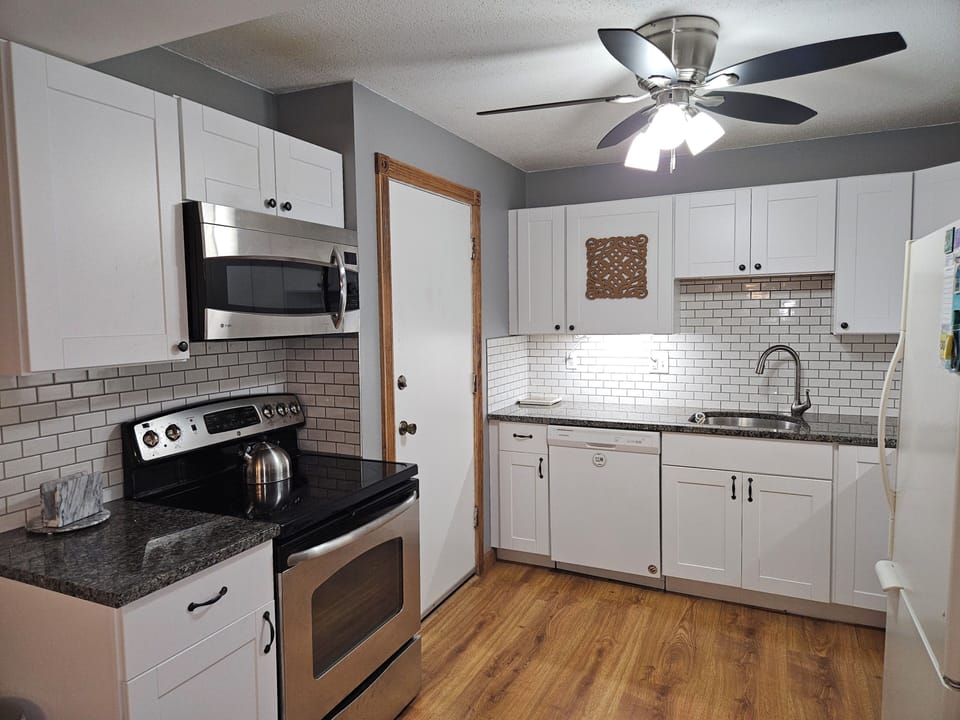 kitchen, stove top, oven, microwave, 
refrigerator, coffee maker, toaster