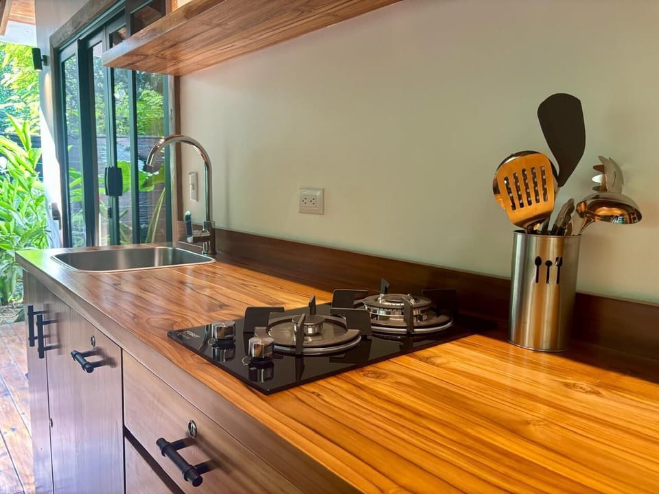Family Room, 2 Queen Beds | Private kitchen | Stovetop, coffee/tea maker, electric kettle, toaster