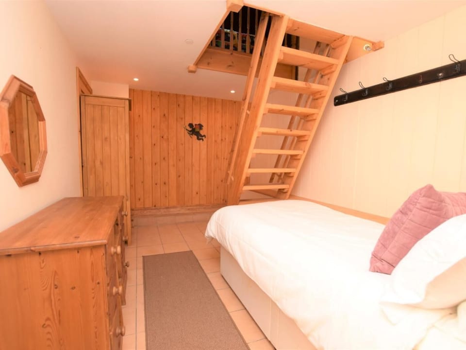 Quirky third bedroom with access up to the den