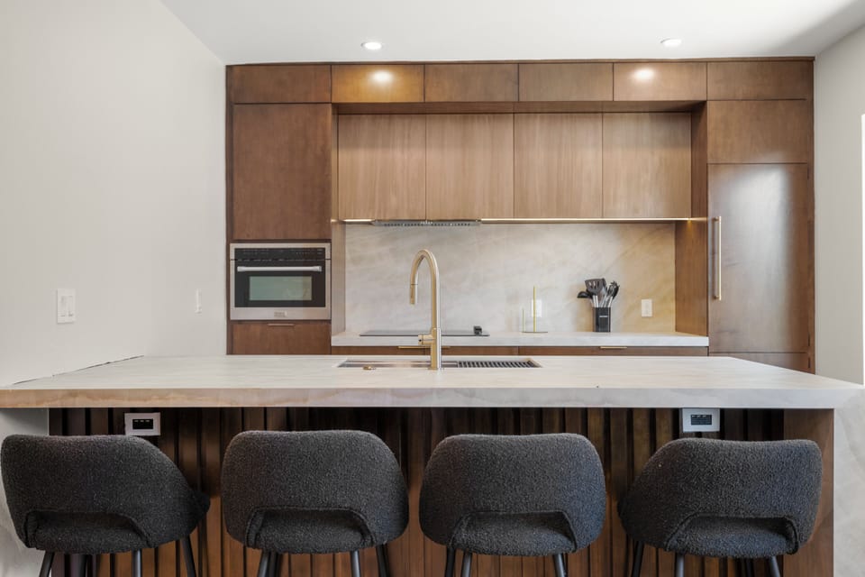 Modern designer kitchen with large island seating for four