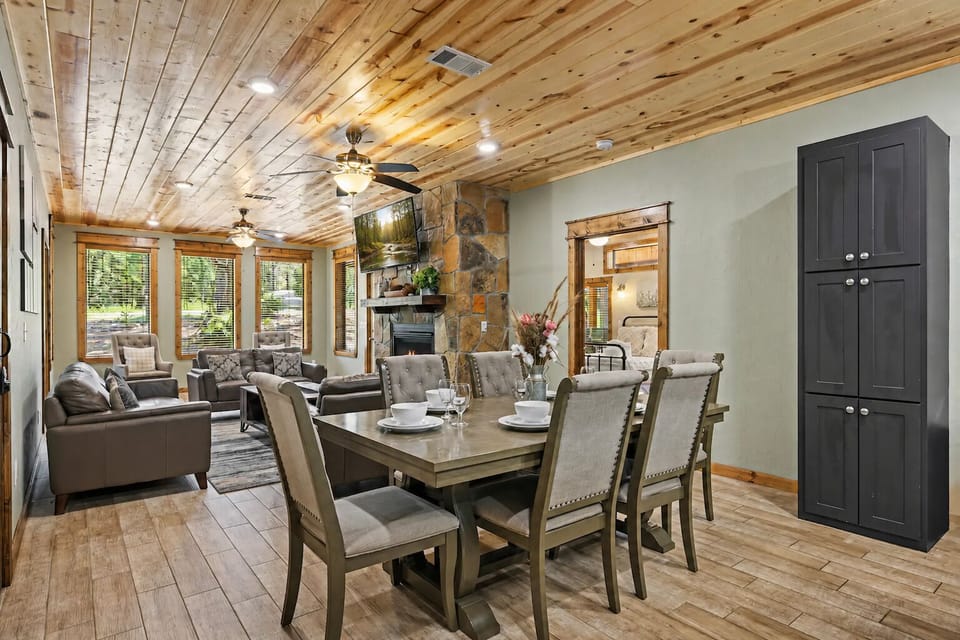 Open-concept dining area with generous table and bar seating