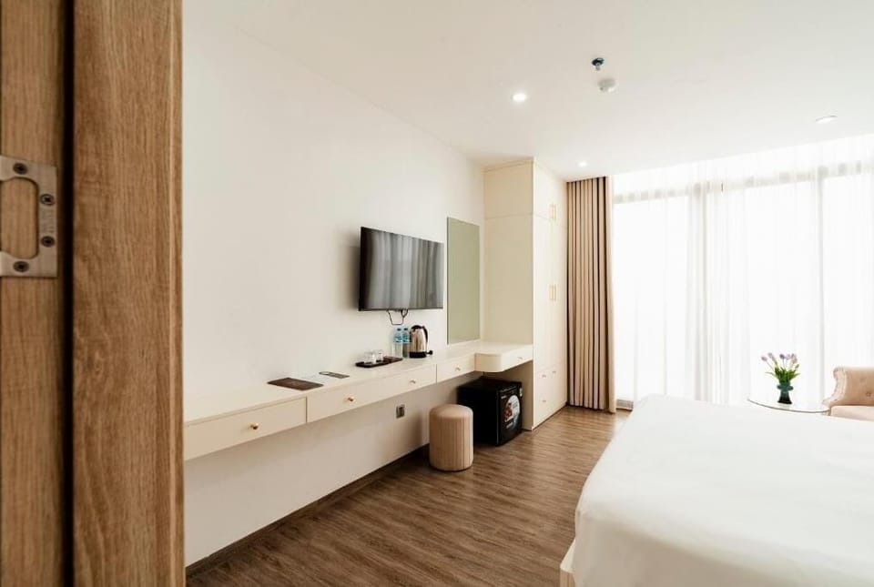 Deluxe Double Room, Balcony, City View | In-room safe, desk, laptop workspace, blackout drapes