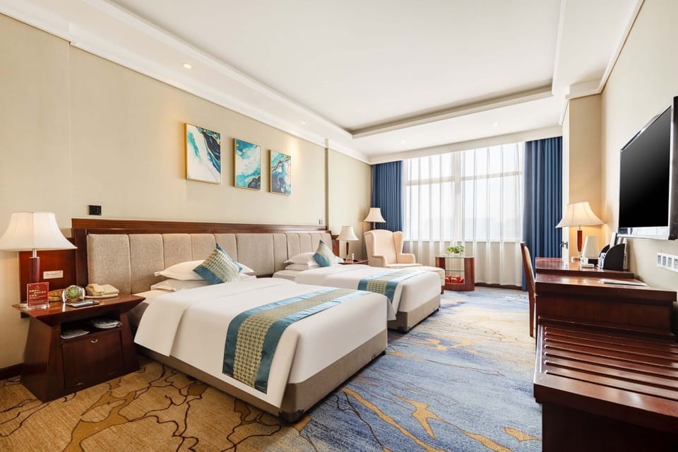 Business Twin Room, City View | Minibar, desk, laptop workspace, blackout drapes