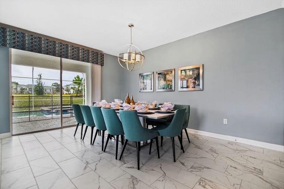 Full view of the bright dining room area adjacent to a sliding glass door.