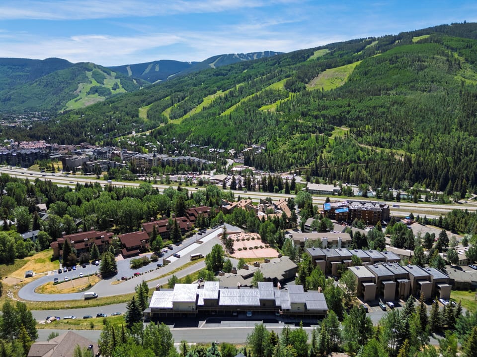 Scenic overhead view highlighting the proximity to world-class ski slopes and outdoor trails.