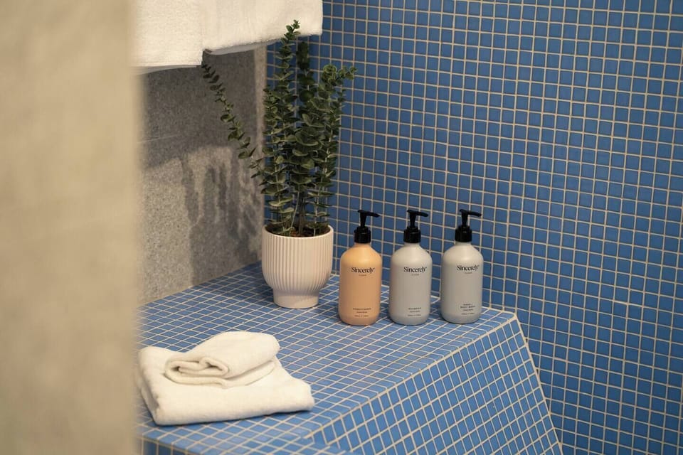 Fresh towels and guest toiletries are neatly prepared for your arrival.