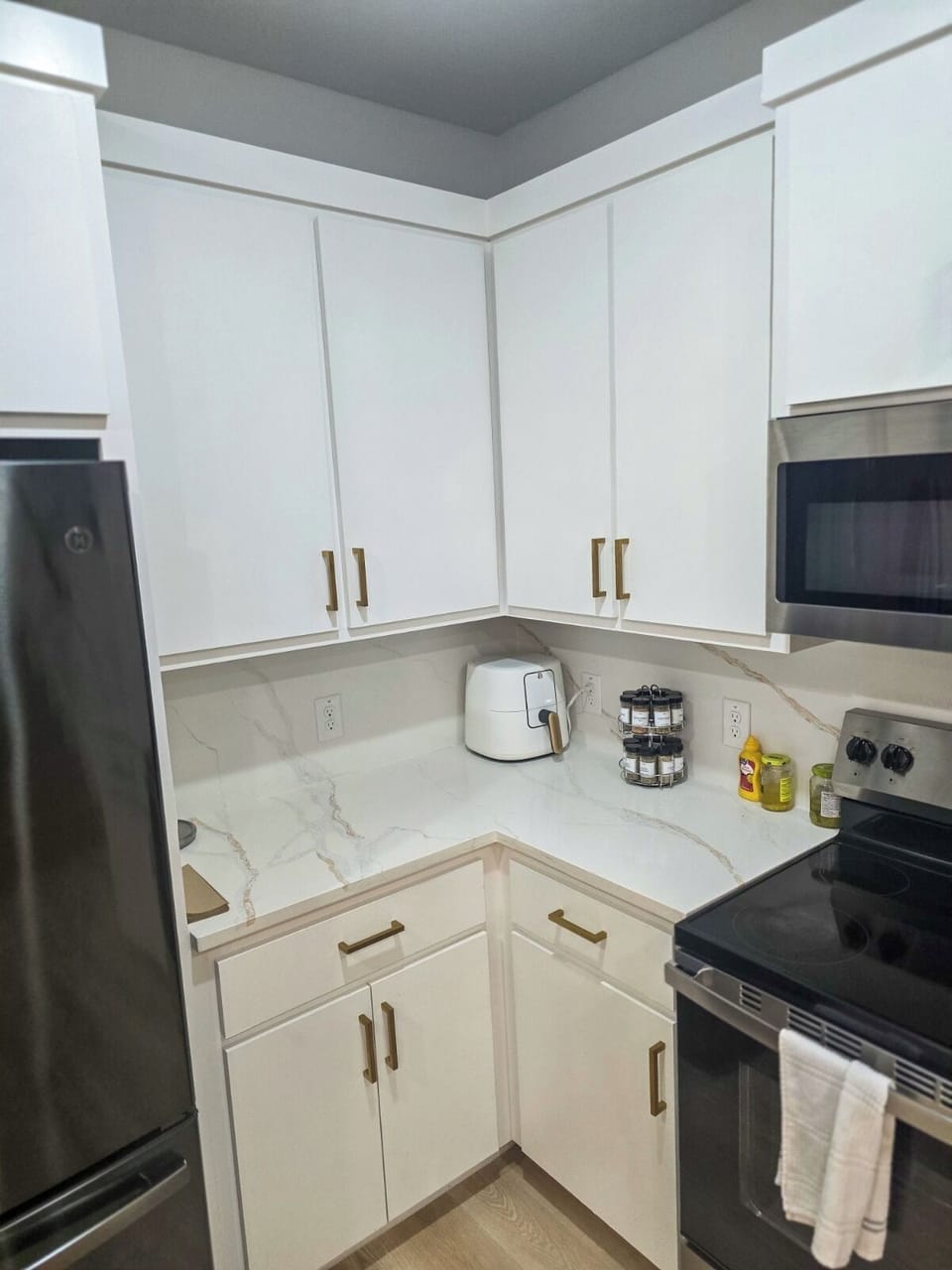 Bright modern kitchen with sleek counters and stainless steel appliances