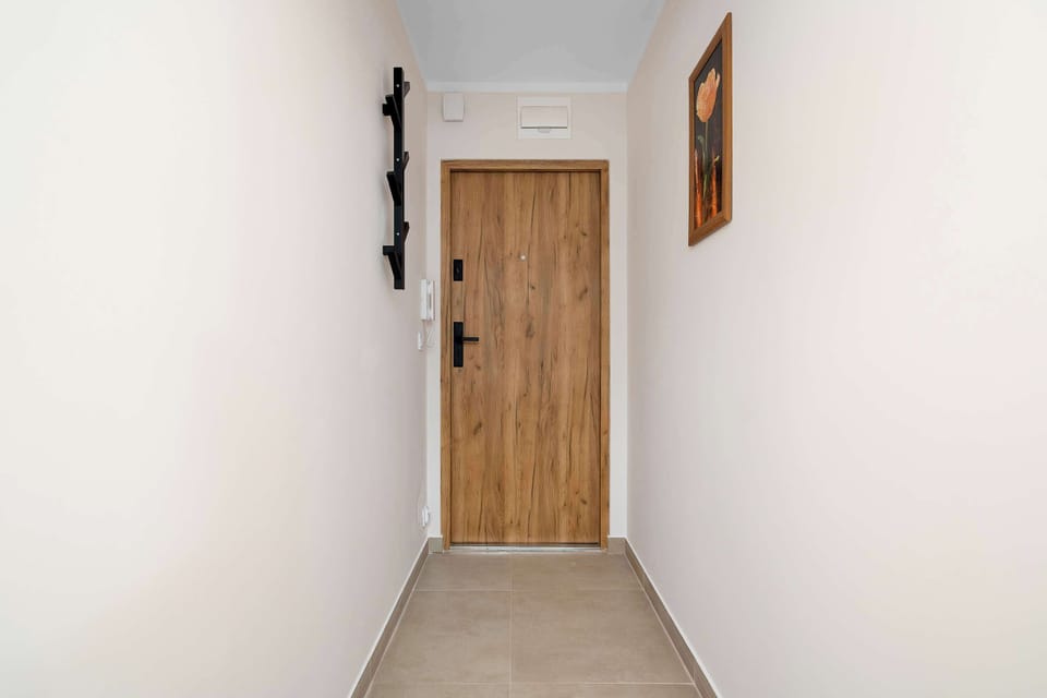 Apartment entrance hallway providing convenient access and a welcoming first impression.