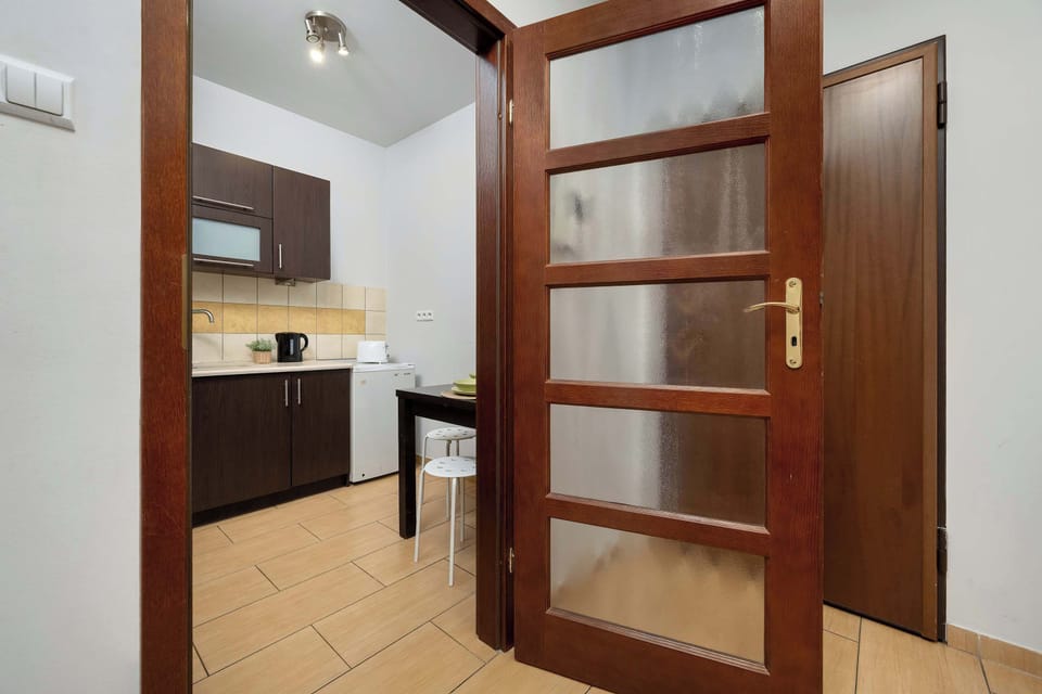 View through the hallway toward the kitchen and living space.