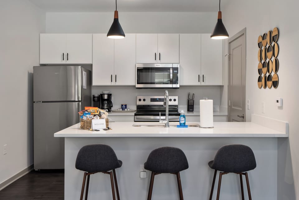 Kitchen island is the perfect place to relax with a cup of coffee or catch up on work