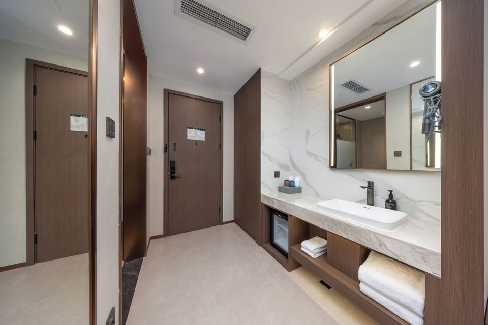 Shower, hair dryer, slippers, towels