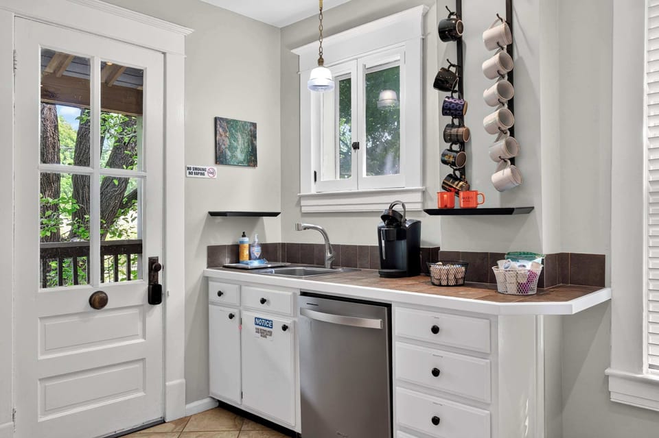 Kitchen: Comfortable and practical kitchen with essential appliances, cookware, and a welcoming space to prepare and enjoy meals together.