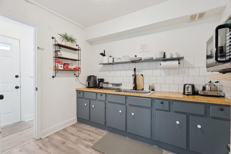 Kitchenette — butcher block counters, microwave, coffee maker.