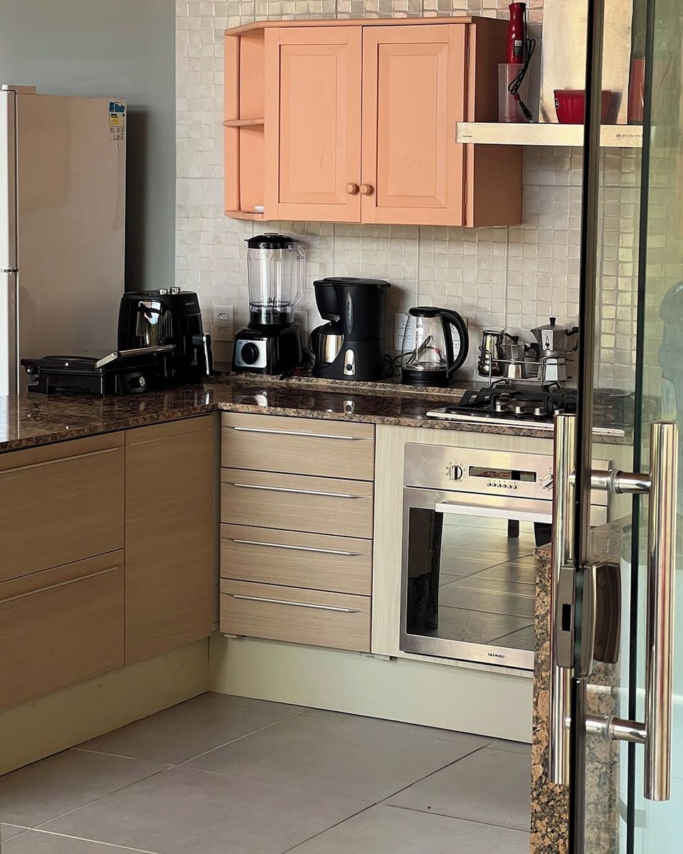 Full-size fridge, oven, stovetop, cookware/dishes/utensils