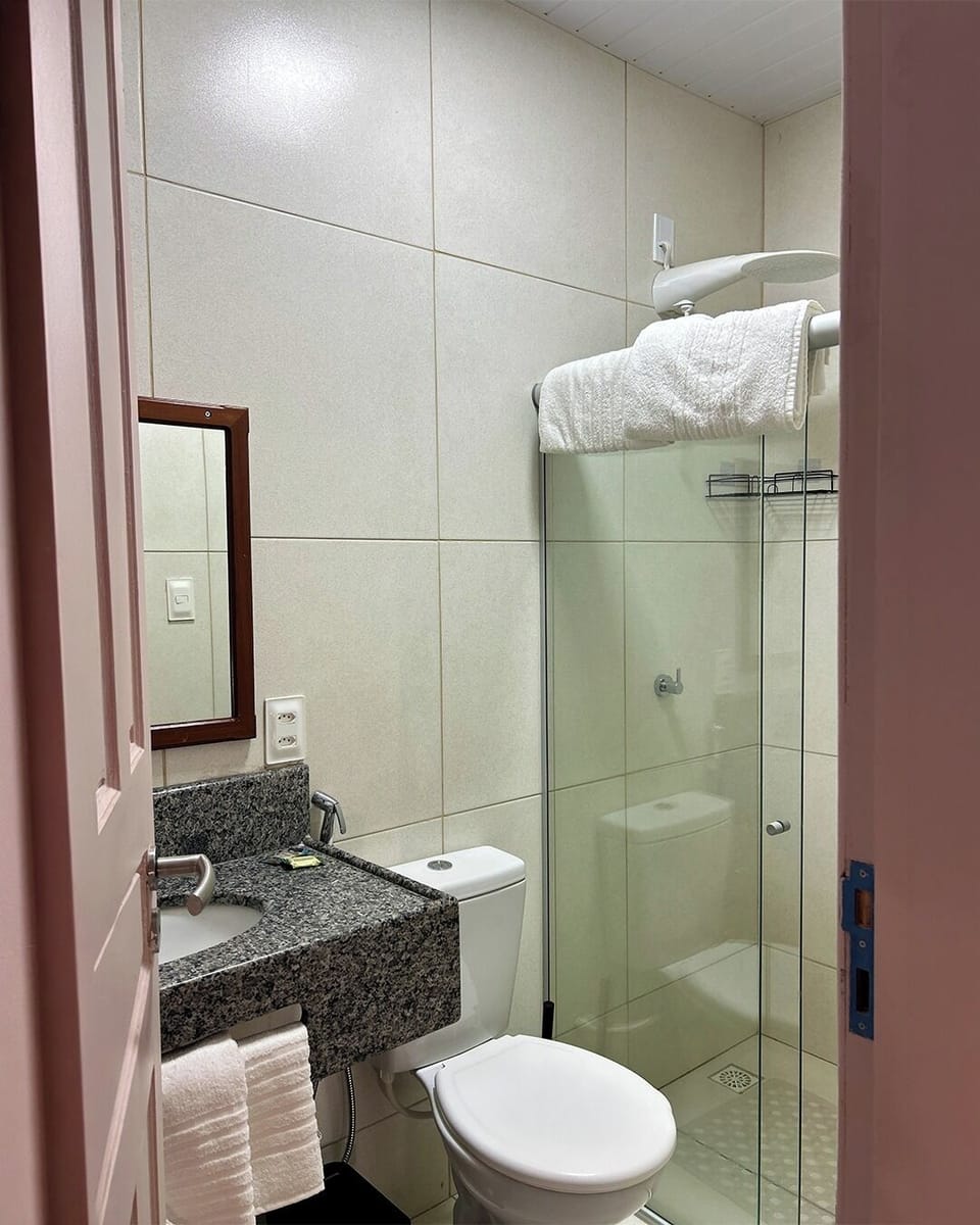 Triple Room, Courtyard View | Bathroom | Shower, towels, soap, toilet paper