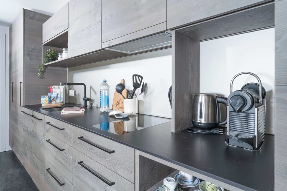 Fully equipped modern kitchen with everything you need for cooking during your stay.
