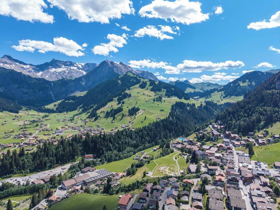 Aerial view showcasing Adelboden's picturesque mountain setting.
