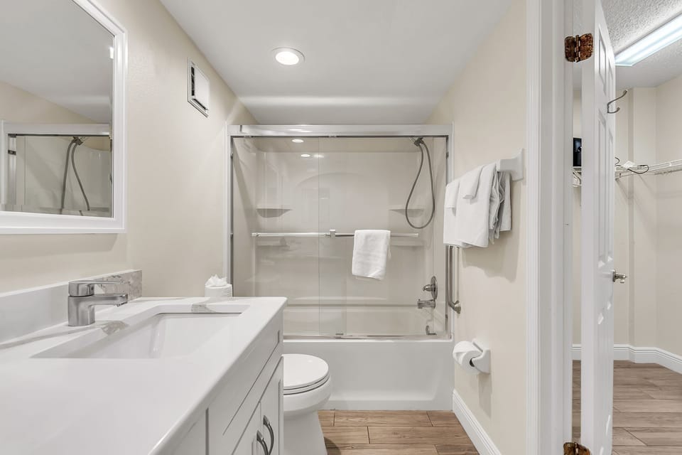 Full Bathroom - attached to Primary Bedroom and Guest Bedroom 1