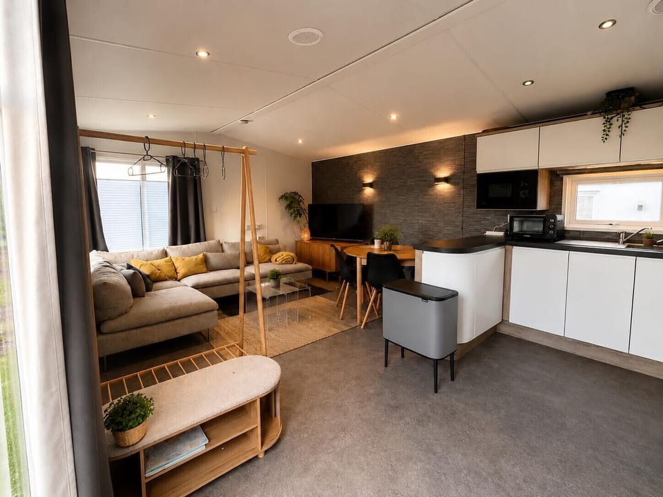 living room with kitchen and cosy dining area