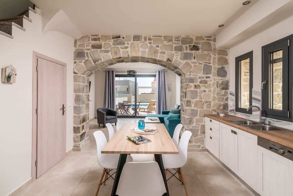 Open-plan dining and kitchen area, perfect for gathering with family and friends.