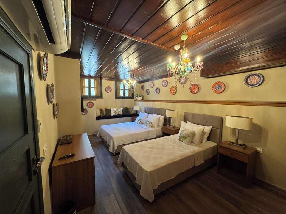 Luxury Suite, Multiple Beds | Minibar (free items), in-room safe, desk, laptop workspace