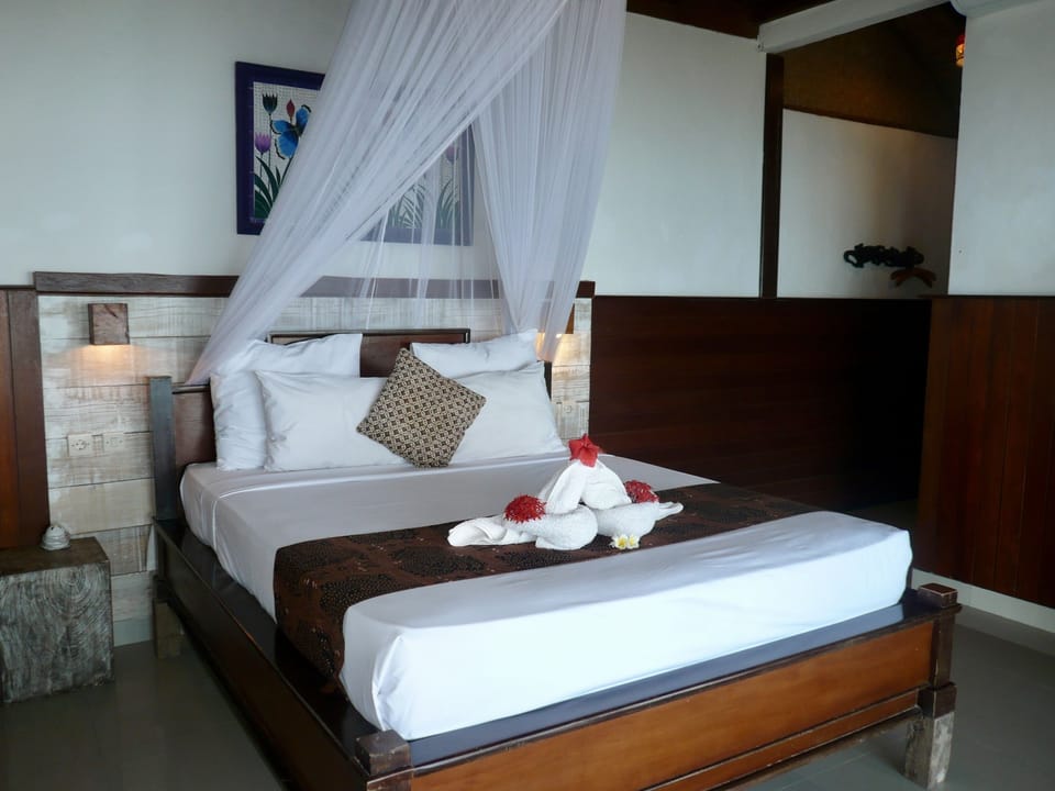 Deluxe Cottage, Ocean View | 1 bedroom, premium bedding, in-room safe, desk