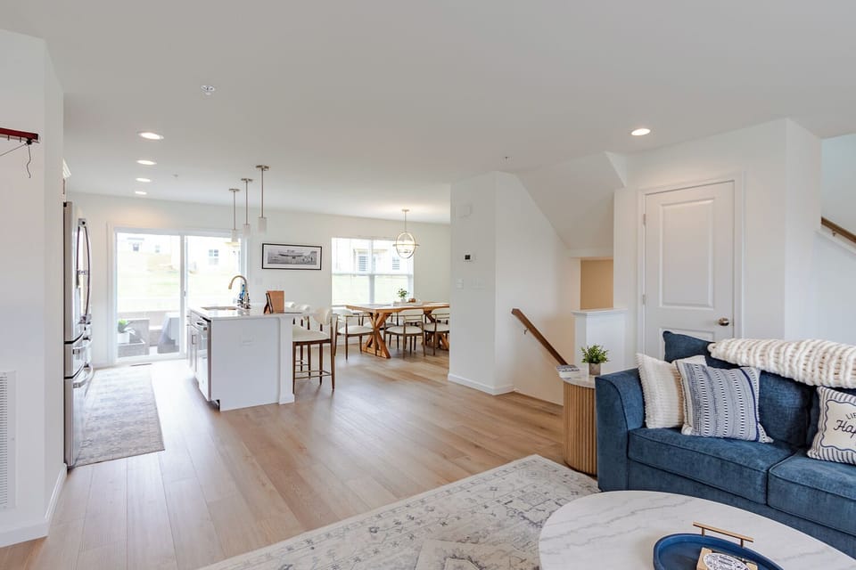 Bright, open and made for gathering. The main level flows seamlessly from the living room to the kitchen, dining area and private deck, giving everyone space to spread out while still enjoying time together.