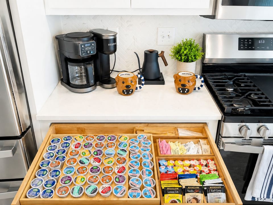 Start your morning your way with a fully stocked coffee and tea bar featuring a Keurig K-Duo Coffee Maker and Fellow electric kettle, plus plenty of flavors, creamers and sweeteners. Grab your favorite mug and fuel up for a great day!