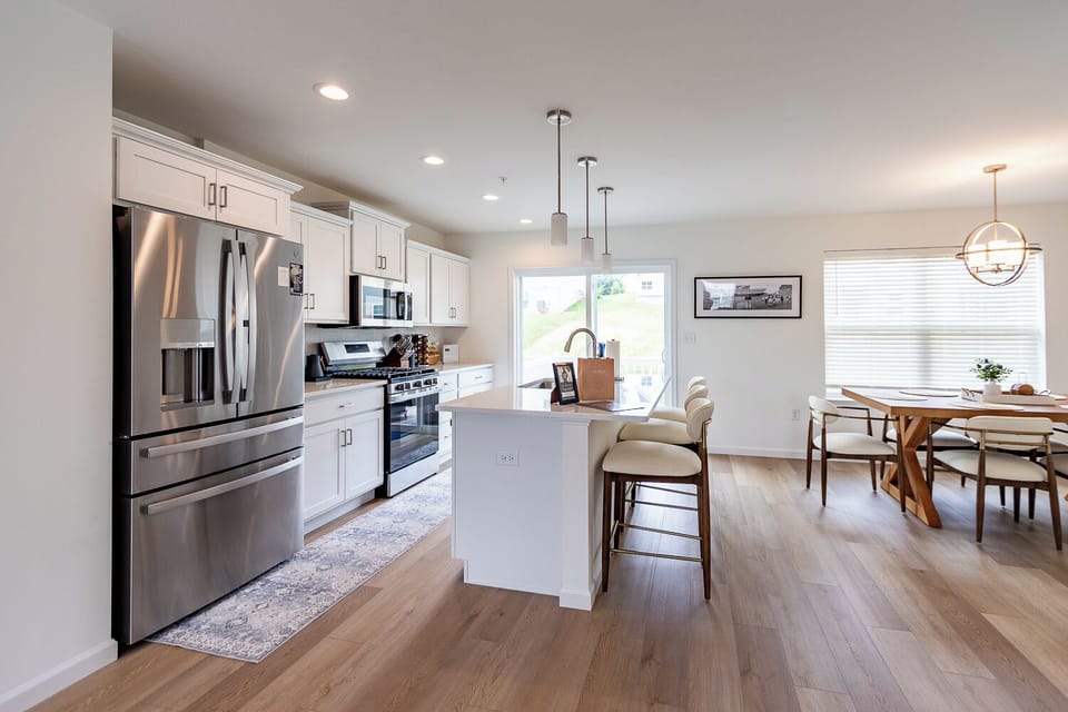 Gather in the heart of the home, where a fully equipped kitchen, spacious island and dining area make everything from morning coffee to family dinners easy. There’s plenty of room to cook, eat and spend time together.