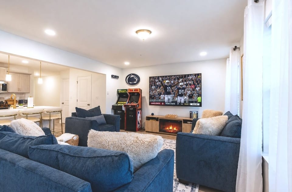 Kick back, catch the game, or challenge the kids to a round of NBA Jam or Golden Tee—the main living space was designed for downtime together.