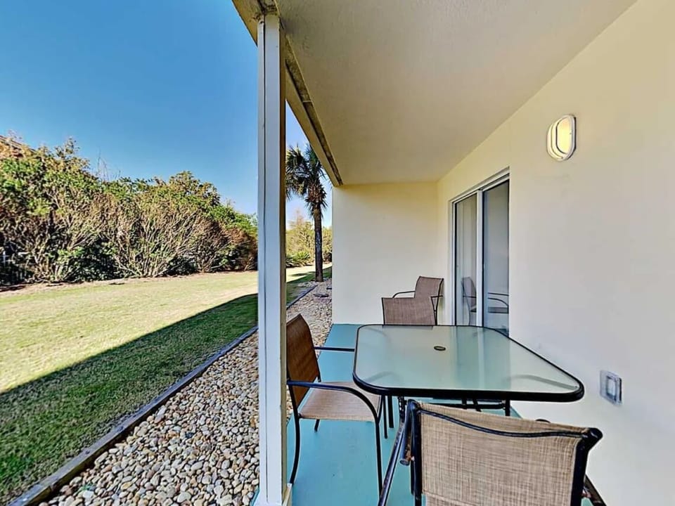 Private patio seating overlooking the landscaped grounds
