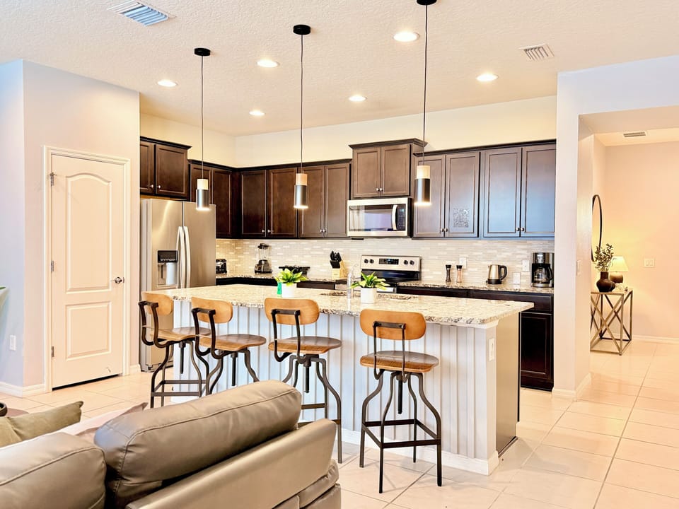 Cook with ease in the fully equipped kitchen with coffee maker and bar seating.