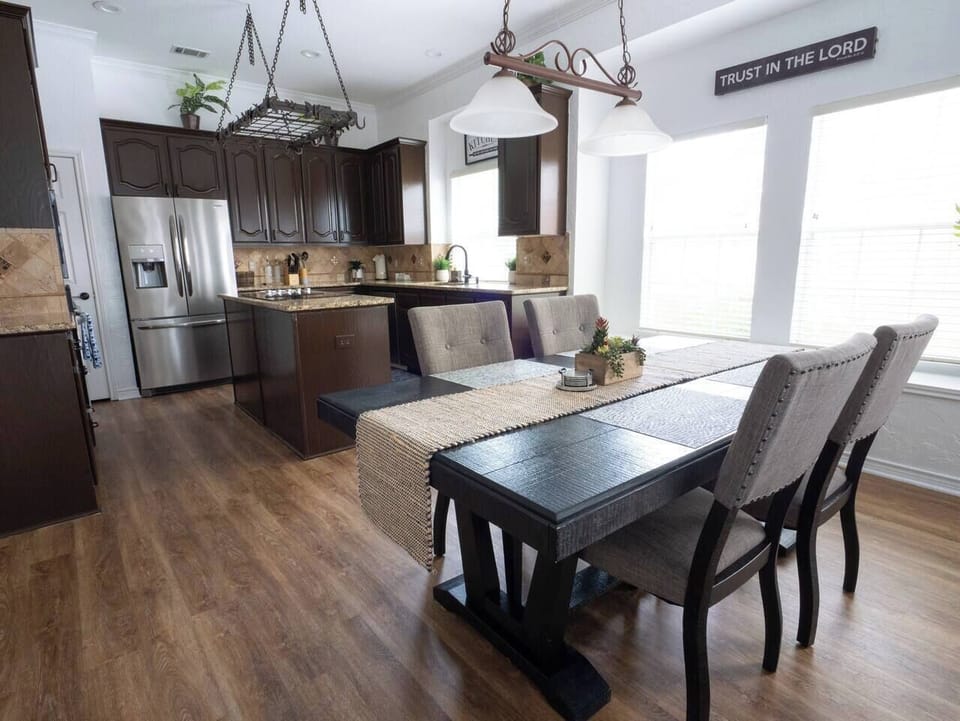 Fully equipped kitchen with all the essentials and a cozy dining area for four.

