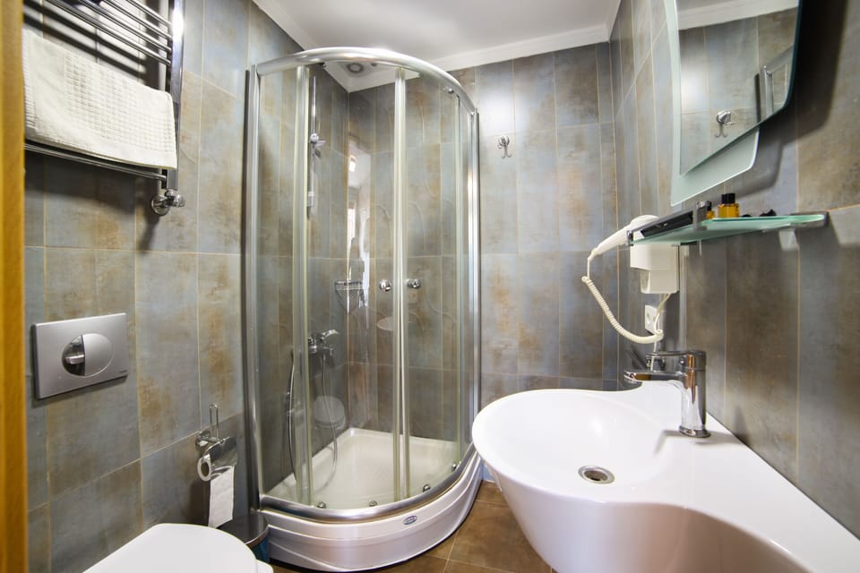 Shower, free toiletries, hair dryer, slippers