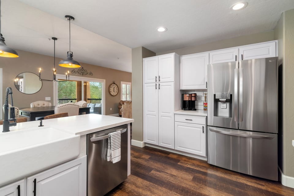 Fully stocked kitchen with premium appliances including gas cooktop, dual ovens, dual ice makers, and wine fridge too. 