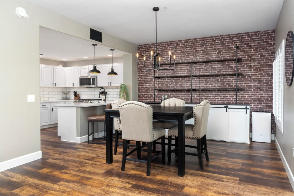 Pass through, bar style seating for the family along with a 4 person dining table near the built in, dual zone wine fridge for all your reds, whites, and sodas. 