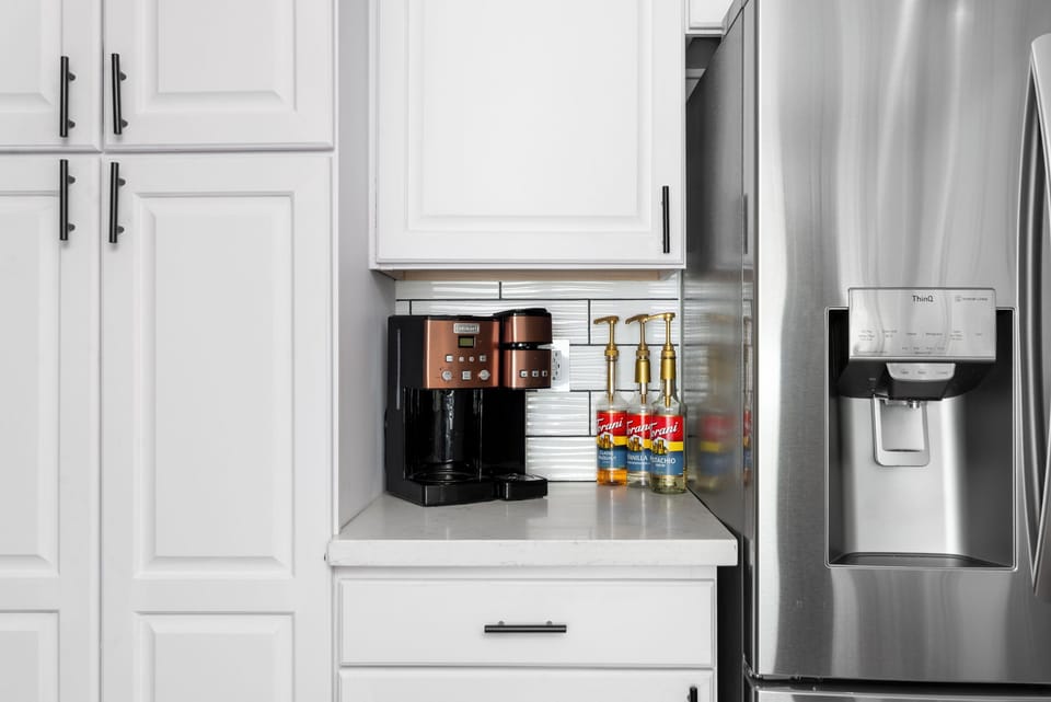 Fully stocked kitchen with premium appliances including gas cooktop, dual ovens, dual ice makers, and wine fridge too. 
