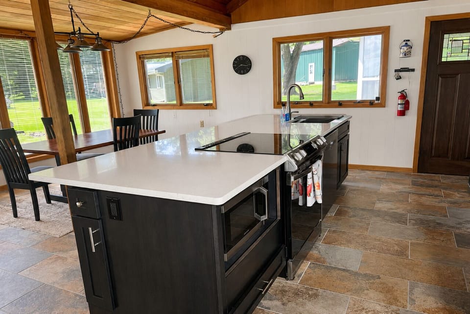 Full kitchen with stove/oven, microwave & dishwasher.