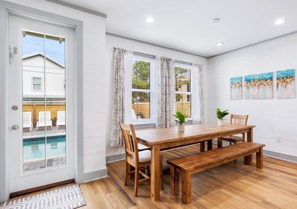1st Floor - Spacious dining room with a custom wood table seating up to 10 guests—perfect for family meals, celebrations, and gathering together during your Miramar Beach vacation!