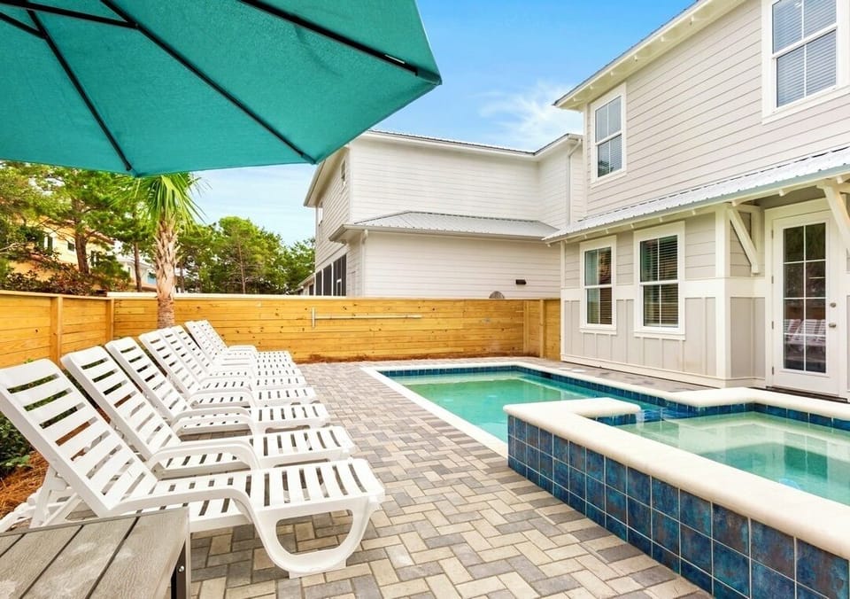 Relax, swim, and unwind in your private backyard with a HEATED pool, attached spa, splash pad, outdoor dining, and gas grill—made for unforgettable family vacations.