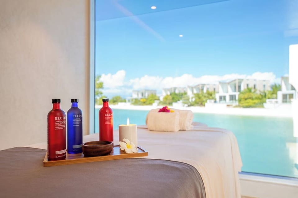 Sink into blissful massages with ocean-blue views beyond.