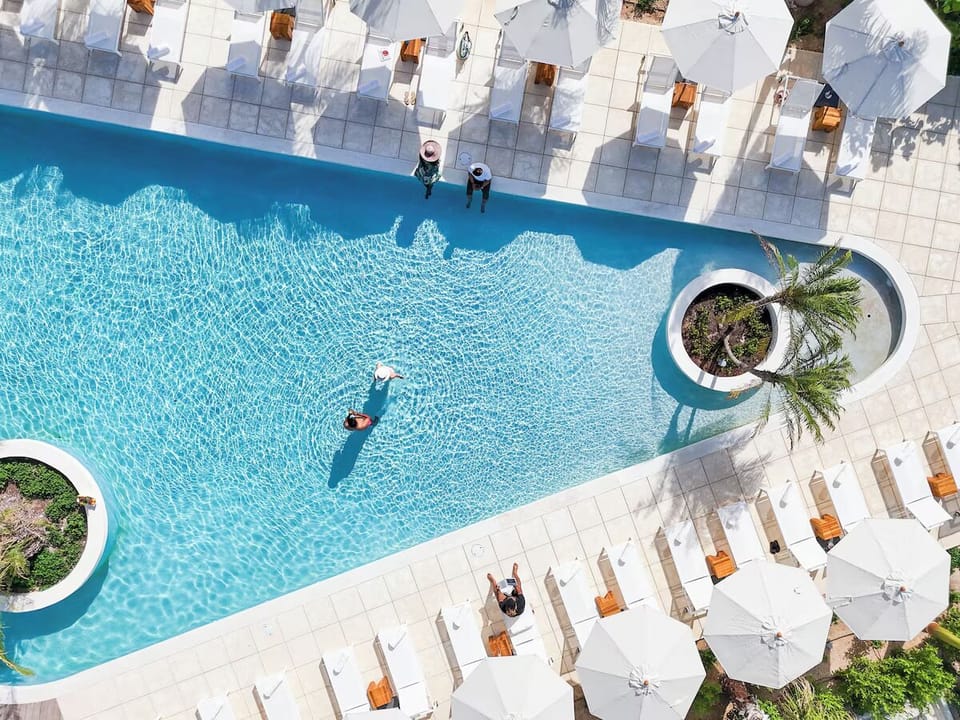 Dive into sparkling blue waters and sun-drenched loungers.