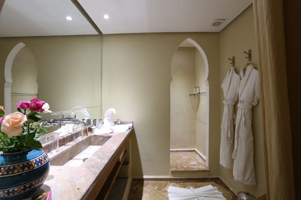 Elite Room | Bathroom | Shower, rainfall showerhead, designer toiletries, hair dryer