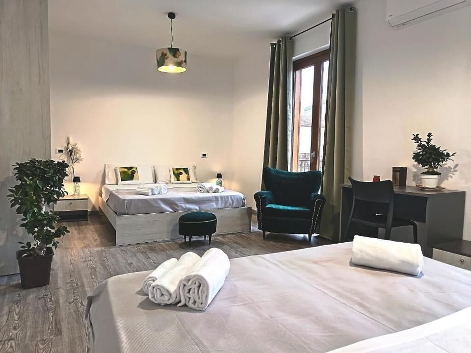 Deluxe Quadruple Room, Balcony, City View | Desk, laptop workspace, WiFi (free)