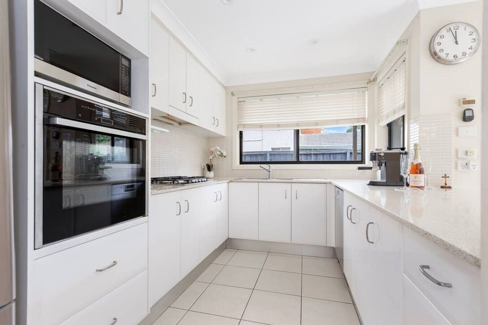 Enjoy the convenience of a spacious kitchen with modern appliances, plenty of storage, and a bright, welcoming atmosphere.