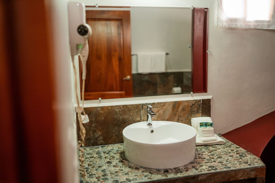 Deluxe Quadruple Room, 1 Bedroom, Pool View | Bathroom | Shower, free toiletries, hair dryer, towels