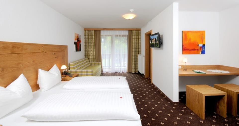 Junior Suite, Balcony, Mountain View | In-room safe, desk, free WiFi, bed sheets
