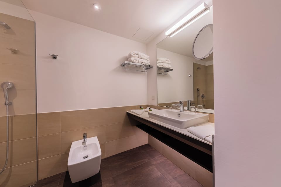 Premium Double Room, Balcony | Bathroom | Hair dryer, slippers, towels, soap